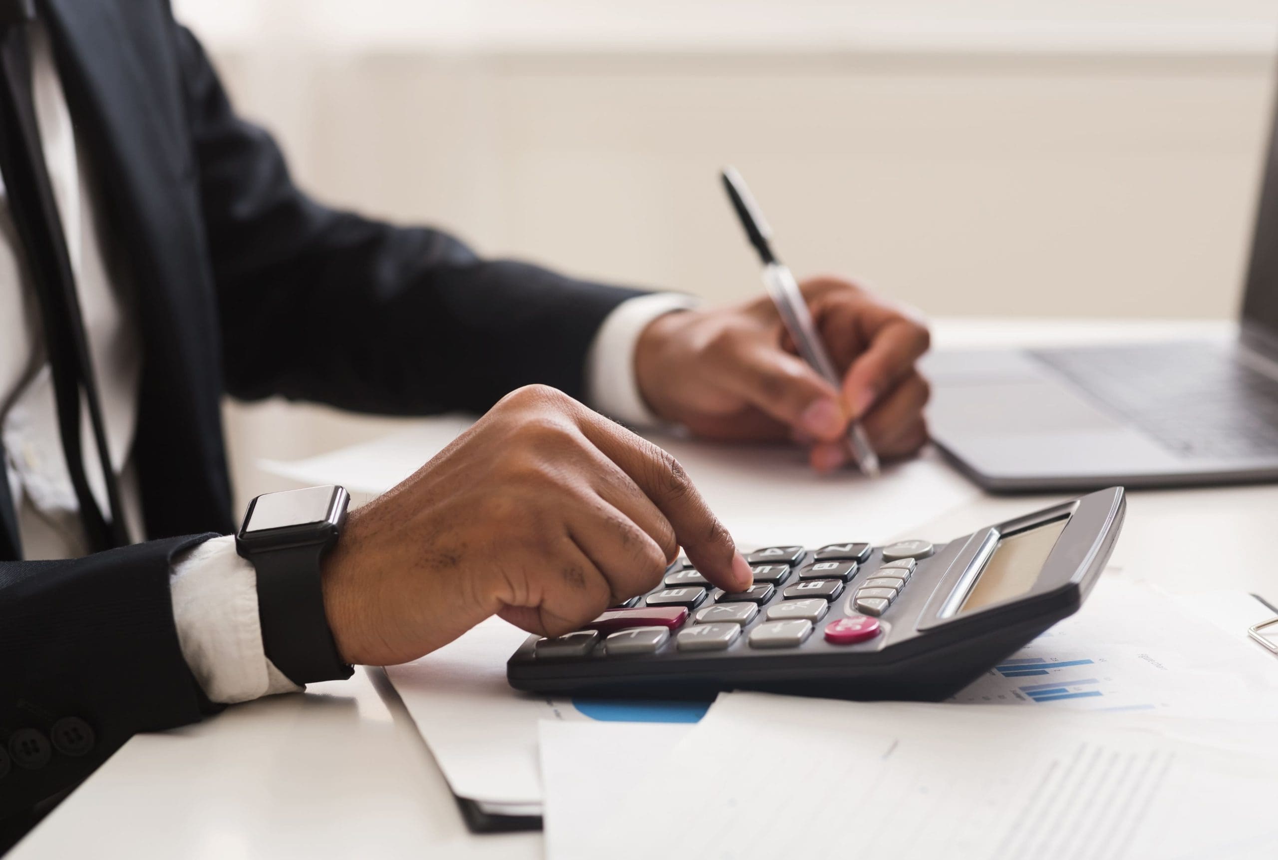 International payroll specialist calculating financial figures